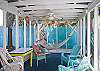 Views of the screened porch on rear of cottage.  Fun, bright and colorful!