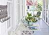 The wrap around screen porch is a great place to relax and enjoy Tybee