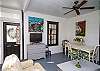 This is the former screened porch that has been fully-enclosed and is now a separate sitting and dining area.