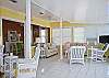 Another view of the large, open living area. This also shows dining area behind the living room.