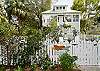Our fully fenced in yard. The picket fence was custom made for us and is a unique design.