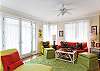 This is a view towards the front door (center) and the dining room to the left. What a great room for playing games, catching up with family and friends, or just cozying up with a good book.
