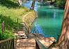 Steps down to the Comal River. 