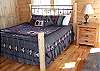 King Siz Bed in the Master Bedroom with Private Fireplace and Cathedral Ceiling.