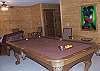 Enjoy a game of pool while you watch a movie on the HDTV in the family room.