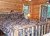 The Master Bedroom offers a King Size bed and is loctaed on the Main Floor with access to a private outside screened coffee porch adjoining bathroom with jacuzzi tub and walk in tile shower.