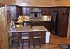 The fully furnished kitchen probides extra seating at the bar for 3.  Marble cabinet tops and stainless steel appliances provide a beautiful area for preparing your family meals during your stay.