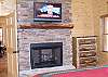 Master Bedroom is enhanced by a gas log fireplace and 32' LCD Flatscreen TV.