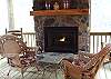 Enjoy your morning coffee on the Screened Porch while you warm by the  Gas Log Fireplace which is adjacent to the Kitchen and Living Room Area