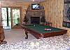 Enjoy a game of Pool or a Movie or just sit back by the gas burning fireplace.  There is also access to the Hot Tub Patio from the family room.