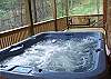 Relax in the warm waters of the Hot Tub or enjoy the porch swing on the lower deck of the cabin.