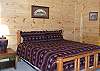 There is a King Size Log Bed in the 3rd bedroom located in the Lower Level of the cabin