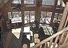 This shows the Living Room from the Stairs that lead upstairs.  You can enjoyr the long range views from every area of the living room