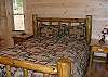 Queen Size Log Bed on Main Floor.