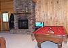 Relax and enjoy a game of pool or watch a movie in the family room located on the lower level.  Access the Hot Tub Deck from this room of the cabin also.