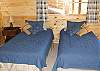 The bedroom downstairs offers twin beds. Has it's own bathroom and access to the family room.