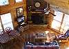 The Living Room is centered around the Wood Burning Fireplace and also provides a LCD TV with Direct TV Service.