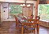 The Dining area offers seating for 6 with a wall of windows  for a wonderful dining experience for you and your family