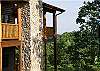 From the side view of the cabin you can see the decks and the mountain view you can enjoy.