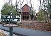 From the bottom of the driveway to the top it's a beautiful view of this magnificent cabin.