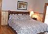 The Master Bedroom offers a King Size bed with  adjoining Master Bath with has a Jacuzzi Tub and walk in shower. The French Doors exits onto the large  deck which offers a limited mountain view and wildlife abounds