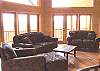 The living room has upscale leather furnishings which are enhanced by the Gas Log Fireplace and Open Windows for a continual view of the mountains