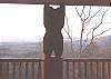 Bear Mountain Lodge Center attraction of the outdoor fireplace deck stands firm as he seemingly holds up the upper deck.