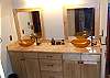 In the Lower Level Bathroom there are double bowl vessel sinks.