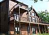 You can enjoy the mountain view from all areas of the cabin.  The living room provides a wall of windows for your view.  Each level provides a deck from accessible from each bedroom.