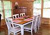 The dining room flows from the kitchen and living room area and has seating at the table for 6 with extra seating provided at the kitchen bar.