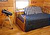 There are 2 bedrooms on the main floor of the cabin. This bedroom contains a Trundle Bed which Pulls Out out and makes a King Size Bed. Three is a telescope for you to use to check out the stars by night.