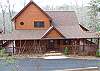 The front entry has easy access for those who are unable to climb steps.  This cabin entrance is ground level for those that have problems with step entrances you can entry Peace of Paradise with ease. Paved Parking all around.
