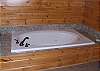 There are Jacuzzi Jetted Tubs in both the Main Level and Upper Level Bathrooms which also have custom tile showers with body sprays.