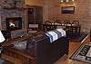 The large great room offers a full sofa and a love seat centered around the fireplace.
The large dining room table provides seating for up to 8 guests.