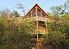 View of the cabin from the front shows you the decks and the large windows.