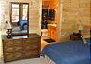 The bedroom on the bottom floor offers twin beds with private bathroom and acces to the Covered deck with Ping Pong Table