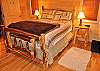 This Bedroom Located on the Main Level provides a Log Queen Bed.