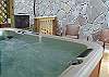 The Hot Tub area provides seating also on the covered deck.