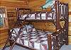 The 4th bedroom is located on the lower level and has a Queen Size bed if you have additional adults or a twin bunk above for your children and their friends. There is a private full bath located just across the hall.  This room is beautifully decorated in a fishing theme to put you in the mood to take off to the Toccoa River or Lake Blue Ridge located only minutes from the cabin and do some Trout Fishing