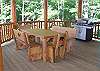 Enjoy Dining Outdoor with the Log Dining Table and Gas Grill provided on the Grilling Deck.