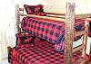 The Sixth Bedroom has a awesome set of log bunk beds. There is a full size bed on the bottom and regular bunk bed on the top