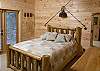 Enjoy the fishing theme in the downstairs bedroom which offers access to the Hot Tub Deck.