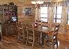Dining Table with seating for 6 with 2 extra seats at the Kitchen Bar.