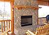 Enjoy the warmth of a woodburning fire as you enjoy a beautiful mountain view from the deck of Bear Mountain