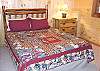 The 5th bedroom in the cabin also has a Queen Size Log bed.