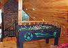 In the Loft area of the cabin you can enjoy a game of foosball with your family after a day of river fun.