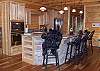 Fully equipped kitchen with Stainless Steel Appliances, Dishwasher, Built in Microwave-Oven Unit,  Coffee Maker and more.  Corian Cabinet Tops, and Hickory Cabinets and The Welcome faces of the Black Bears on each chair.