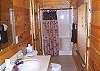 The bathroom upstairs has a walk in shower.