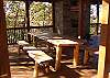 Plenty of room for your family at the outdoor dining table located next to the outdoor kitchen.