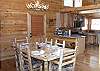 Dining Area with table seating for 6 and extra seating at the kitchen bar.